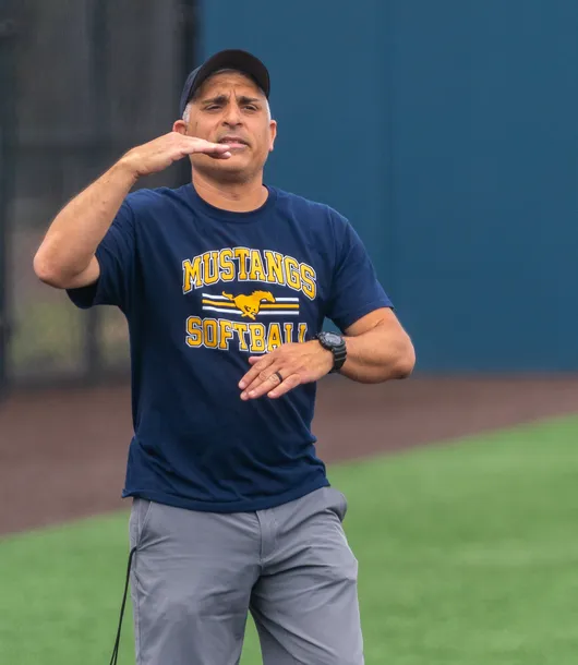 Coach Nick Scalzo on the field